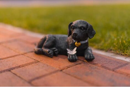 black labrador puppy statue with solar butterfly