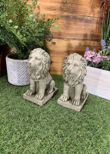 PAIR OF SMALL PROUD LION ORNAMENTS